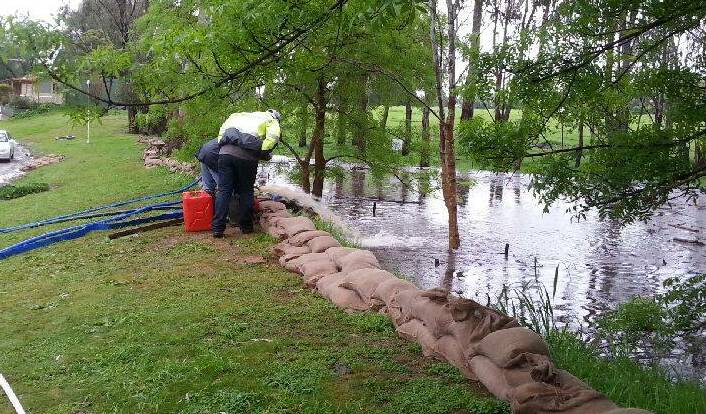 WATER ON THE RISE: Thousands of sandbags were filled and laid at Corowa Caravan Park - the owners are hoping it will be enough. 