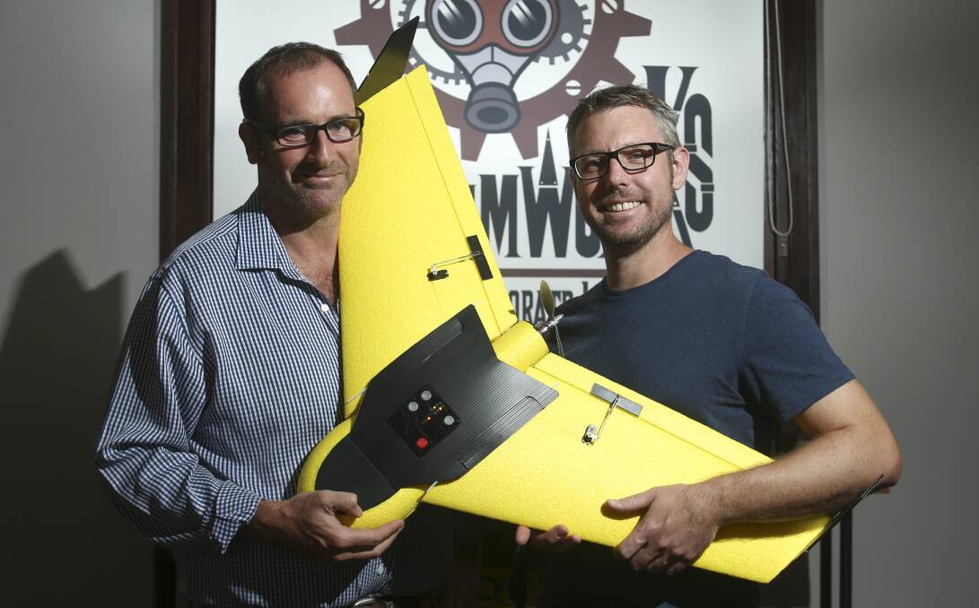 FLY HIGH: Jack Hurley and Tim Sigmund with their drone, which has been selected in the top 10 in a worldwide challenge. Picture: ELENOR TEDENBORG