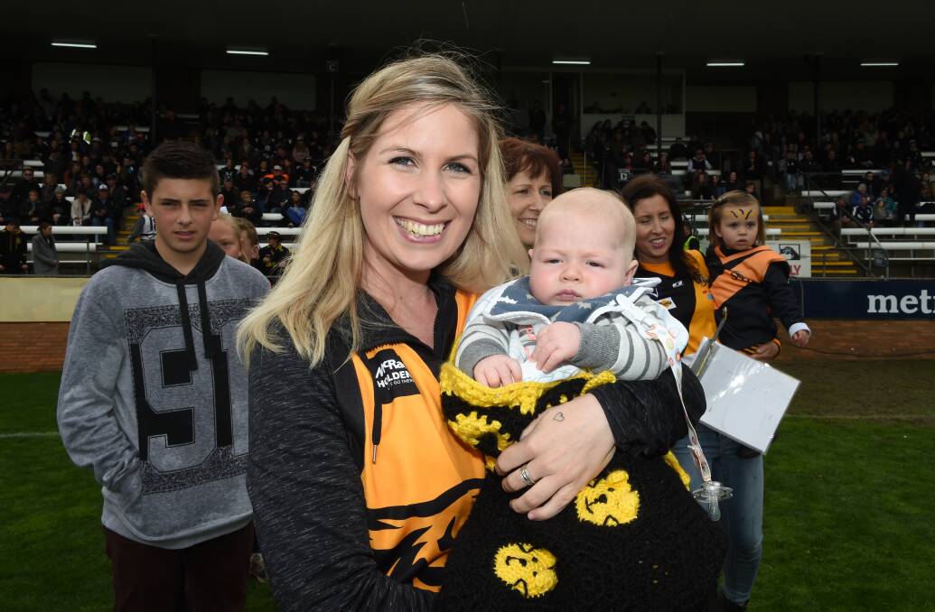WINNERS: Steph Park with her son Max Daly, 10 weeks, on the Lavington Oval on Sunday.