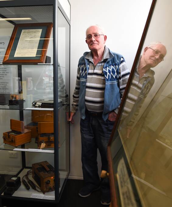 BRIGHT HISTORY: Mr Wooding at the Electricity in Albury display at the Library Museum, which will run until October 3. Picture: MARK JESSER