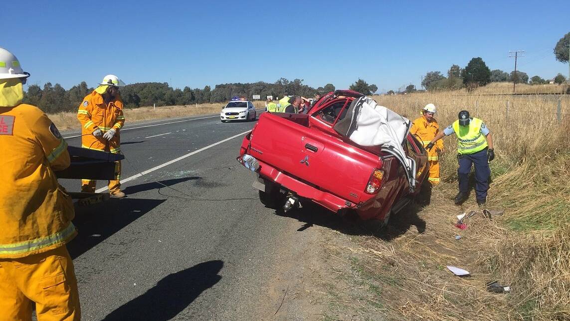 LUCKY ESCAPE: A red Mitsubishi Triton which rolled near Tynan Road, Table Top, on Saturday. Picture: TABLE TOP RURAL FIRE BRIGADE 