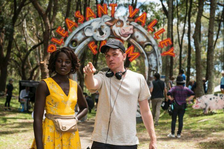 Lupita Nyong'o and director Abe Forsythe on the set of the film Little Monsters in Sydney. Photo: Simon Cardwell 