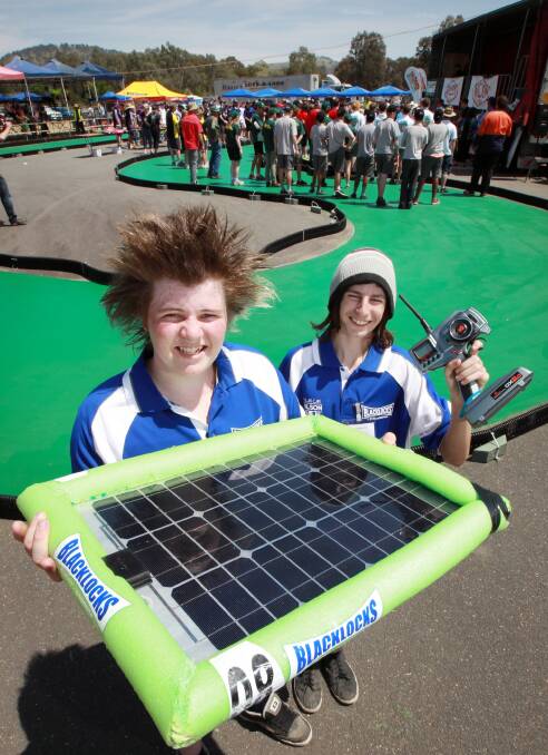 Robbie Wainwright and Waren French with the solar-powered car. Picture: KYLIE ESLER