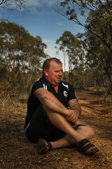 RIGHT: Daryl Floyd, 46, sits in the area where he believes his brother Terry Floyd was murdered, along the old Pyrenees Highway, the last known sighting of Terry. Daryl is excavating the Morning Star Mine Shaft, five kilometres from Avoca, in a bid to find the remains of Terry. Picture: FAIRFAX