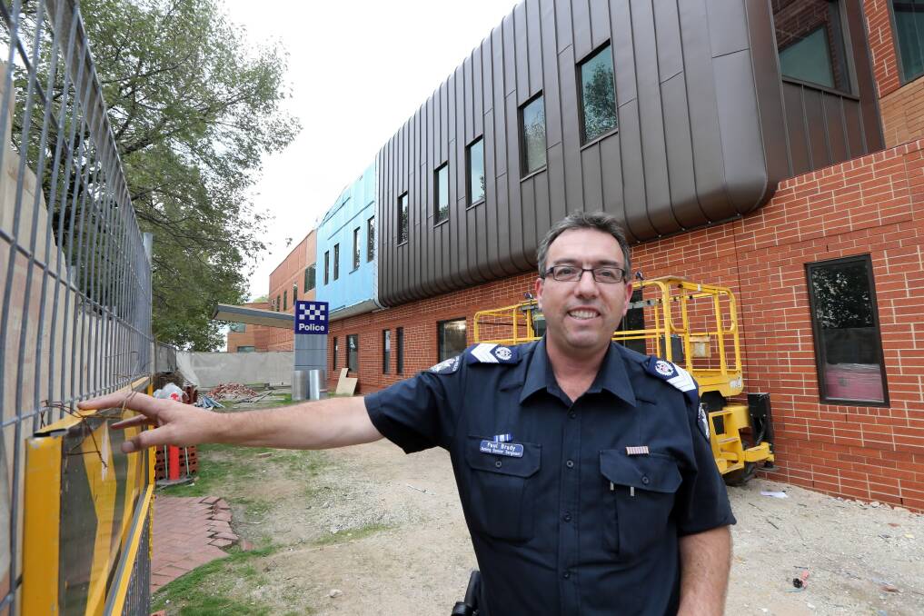 Paul Brady checks on progress at extensions under way at the police station. Picture: PETER MERKESTEYN