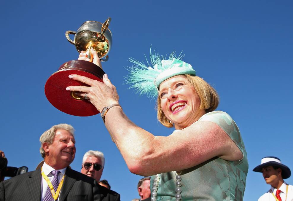 Gai Waterhouse the trainer of Fiorente holds up the Melbourne Cup after winning Australia’s premier race in 2013. Picture: GETTY IMAGES