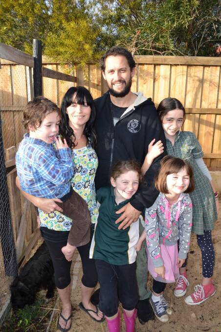 Lucky to be alive: Quake hero Dan Lee spends time at his Margaret River home with wife Suzette and children, from left, Emmett, Matilda, Heidi and Maisy, before flying out to receive his New Zealand Bravery Medal.