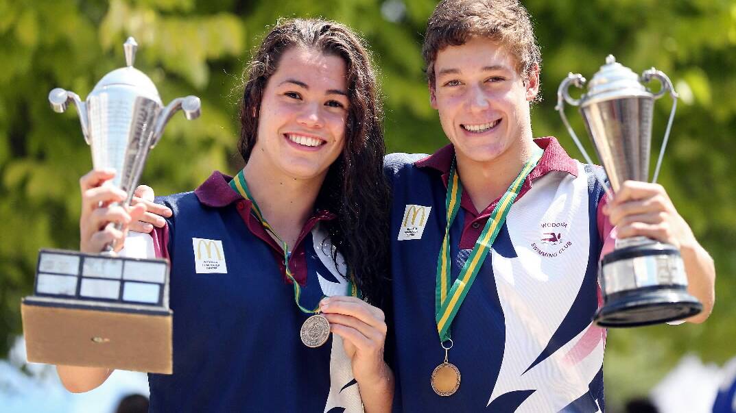 Wodonga Swimming Club’s Georgia Stadelman and James Jarrous after taking out the open boys and girls 100 metre freestyle at the championships.