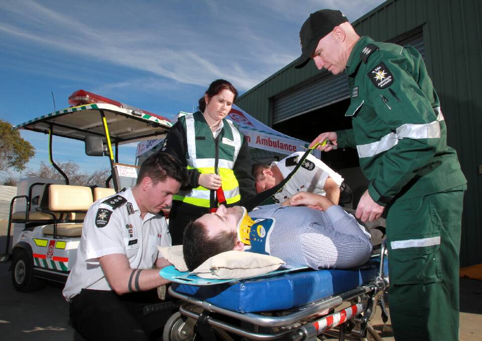 Ben Scott, Corinna Farrer, Tony Judd and Ricky Dobson care for a mock patient. Picture: KYLIE ESLER