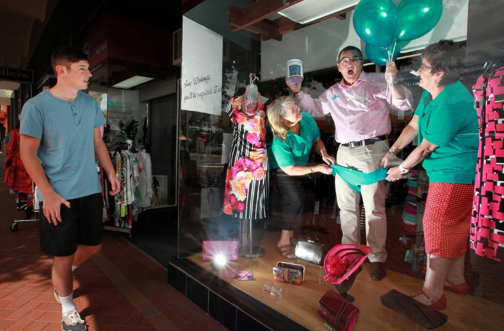 Blair Yates, of Wodonga, couldn’t ignore the antics of ovarian cancer awareness group president Heather Watts and Genevieve Boutique’s Dawn George who got in the spirit of the campaign by ensuring Bernie Squire “suffered in his jocks”. Picture: KYLIE ESLER
