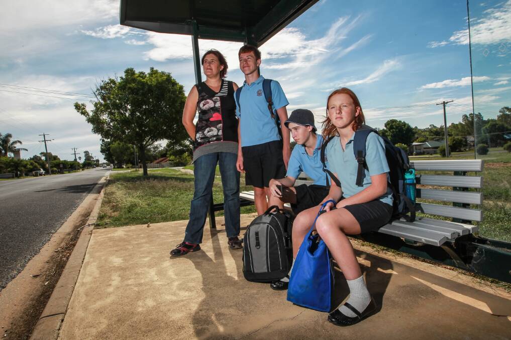 Jessica White with her children Timothy Wilson, 14, Jack Wilson, 18, and Elizabeth White, 12, who have to pay for the bus to school from Wahgunyah. Picture: DYLAN ROBINSON