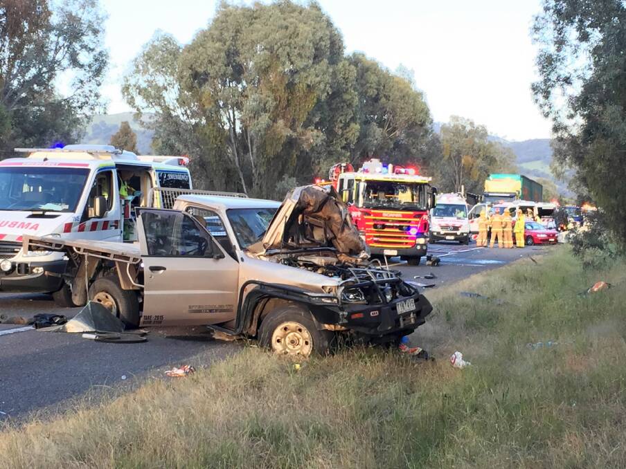 It’s early morning chaos on the Hume Freeway near Wodonga as ambulance and fire officers start the clean-up. Picture: REECE RAYNER