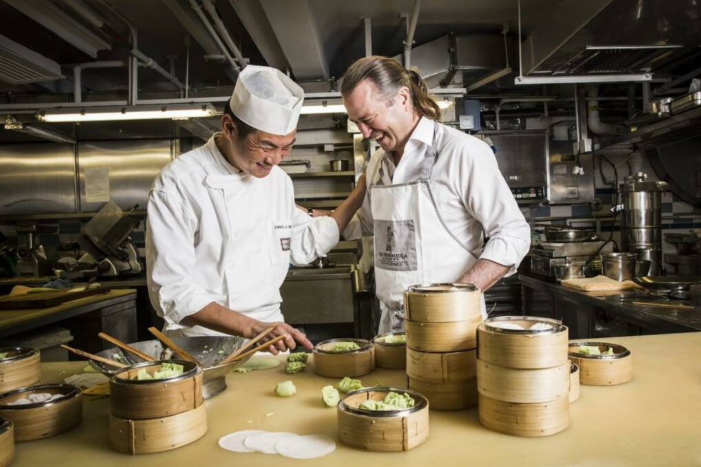 Dumpling master Fong Li Hing (left) with chef Neil Perry. Photo: Callaghan Walsh