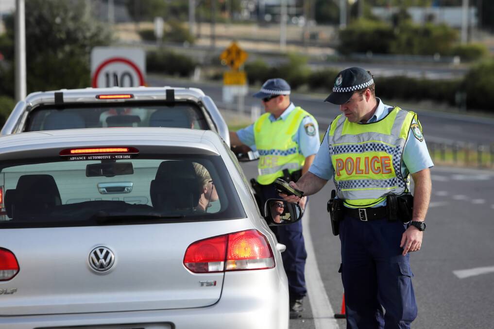 Sen-Constables Paul Wiscombe and Roland Mell perform random breath tests. Picture: MATTHEW SMITHWICK