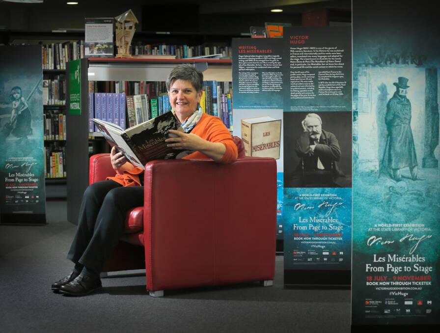 Wodonga Library’s Astrid Kriening immerses herself in the Victor Hugo exhibition. Picture: TARA GOONAN