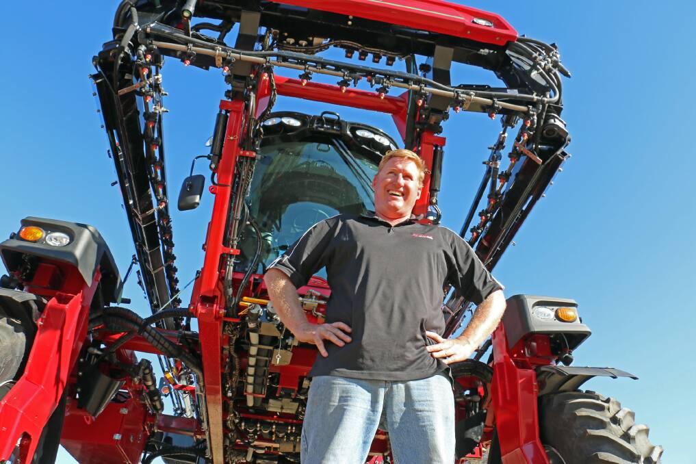 Tamworth’s Scott Jameson is dwarfed by the biggest self-propelled sprayer in Australia, the Miller Nitro 5365 Series, with a 36-metre boom, 6000-litre spray tank and with 365 horsepower. Picture: Kim Woods