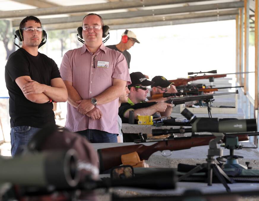 Albury shooter Nathan Ruby, pictured in Wodonga with Shooters and Fishers Party Victorian representative Jeff Bourman, is pushing for suppressors to be allowed on firearms to reduce the effect of noise on users’ hearing. Picture: JOHN RUSSELL