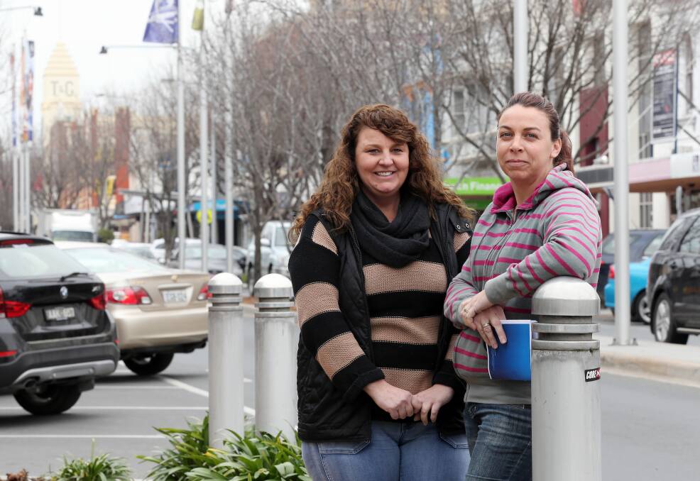 Nicole Boswell and Teneale Pumpa say they need penalty rates to make ends meet. Picture: JOHN RUSSELL