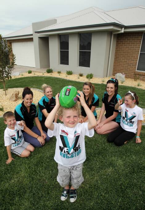Lavington Panthers Roley Sanson, 7, Rhiannon Dolahenty, Angela Demamiel, Jed Demamiel, 4, Tayla Rogers, 15, Kristen Morey, 16, and Olivia Sanson, 9, with the home being auctioned. Picture: KYLIE ESLER
