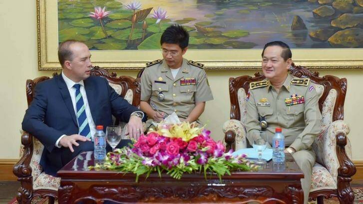 Peter Dutton (left) and Sok Phal (right) meet in Phnom Penh.