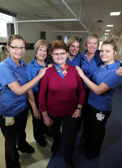 Wodonga Hospital staff Jessica Roennfeldt, Christine Scanlan, Stephanie Sheppard, Michelle McCarty and Emily Hyland farewell Maria Stastny, centre, who has retired after 40 years. Picture: MATTHEW SMITHWICK