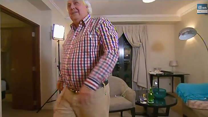 Gone ... Clive Palmer walks out. Photo: ABC TV