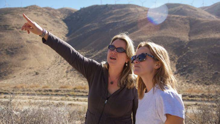 Reese Witherspoon (right) with author Cheryl Strayed on location of the film <i>Wild</i>, based on Strayed's memoir.