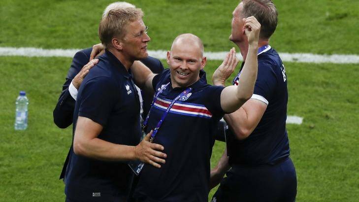 Iceland coach Heimir Hallgrimsson, left, celebrates with staff after the win.  Photo: Francois Mori