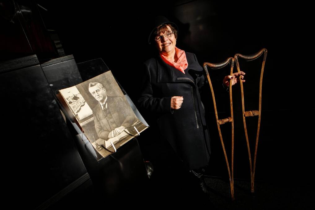 Patricia Young shows the crutches and a portrait of Alfred Waugh. Picture: DYLAN ROBINSON