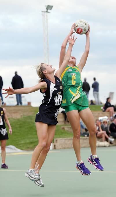 Sarah Vagg, clashing with the Hoppers’ Kimberly Opdam last weekend, has returned to netball this year and run into form ahead of the grand final replay. Picture: JOHN RUSSELL