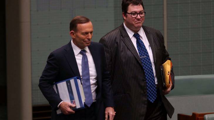 National MP George Christensen, pictured with Prime Minister Tony Abbott, has charged taxpayers for books on climate-change denialism.  Photo: Andrew Meares