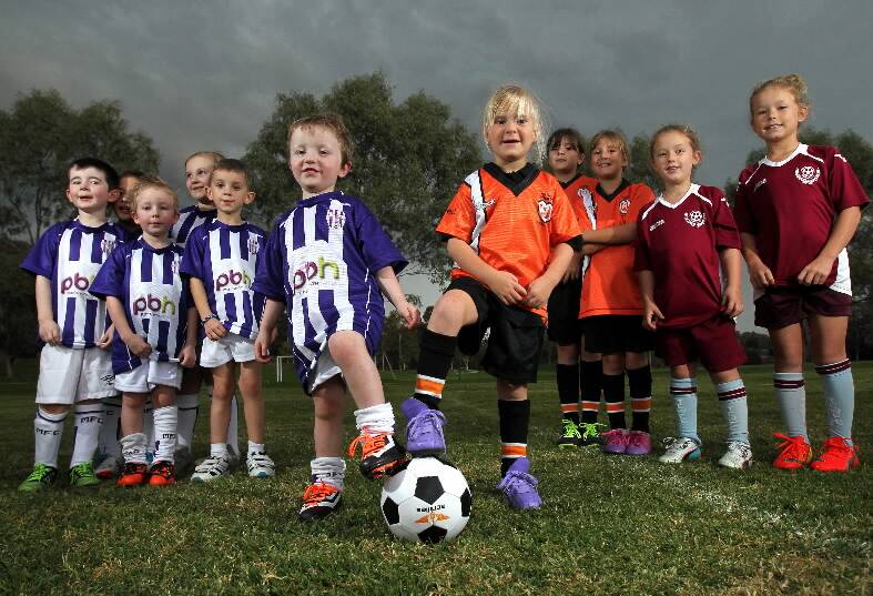 Tyson Young, 3, from Albury and Lilly-ann Pullen, 5, from Wodonga prepare for MiniRoos’ gala day. Picture: KYLIE ESLER