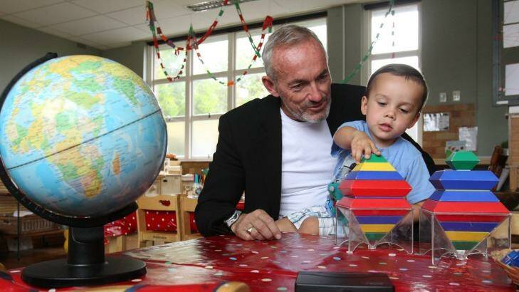 Brendan McAssey, with his 3-year-old son Stirling, opposes means testing of the childcare rebate.  Photo: Louise Kennerley