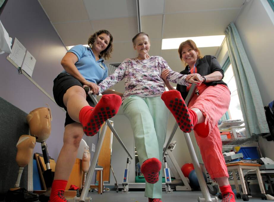 Physiotherapist Meg Symington, Margaret Greig from Lavington and nurse unit manager Lyn Johnstone wear their anti-slip socks to promote the April Falls program. Picture: DAVID THORPE
