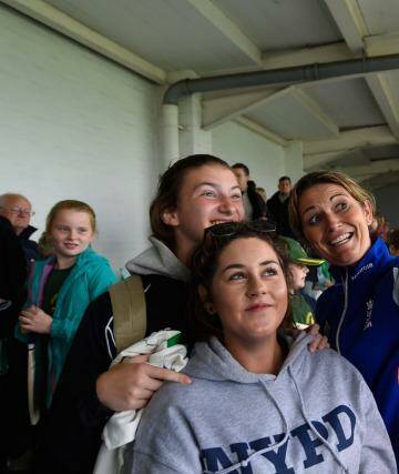 England captain Charlotte Edwards poses for selfies with fans after wet weather delayed the third one-day international of the Women's Ashes series between England and Australia at New Road in Worcester. Photo: Stu Forster