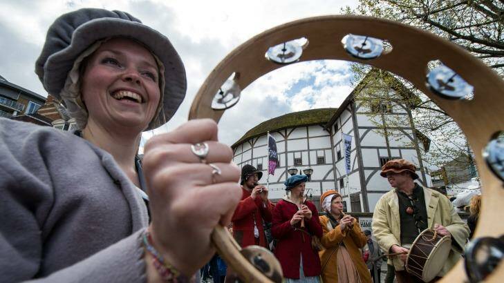 Musicians in period dress play in front of Shakespeare's Globe Theatre in London. Photo: Chris Ratcliffe