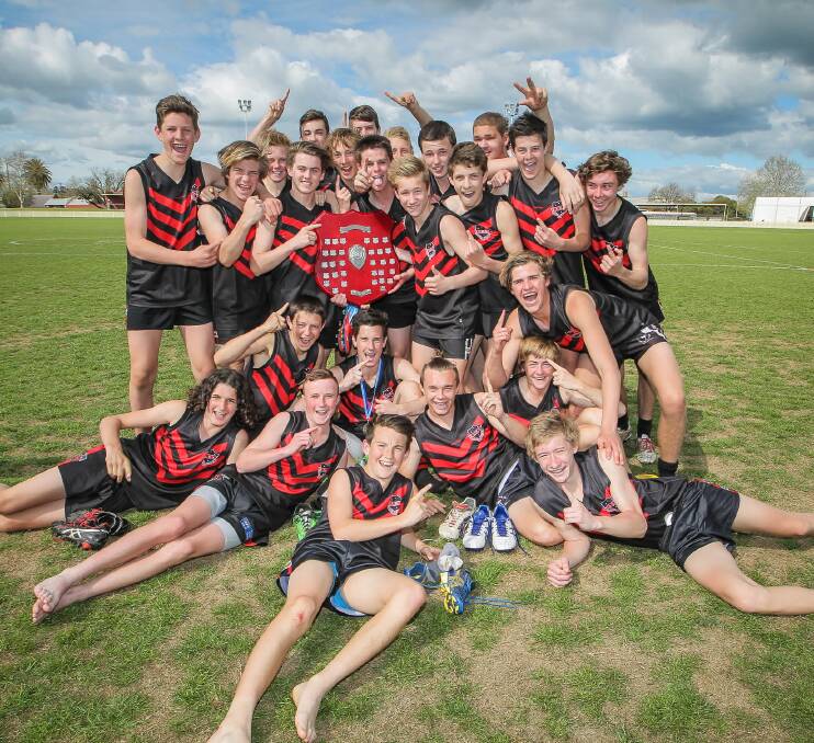 Albury High School players celebrate their Swan Shield victory over Coomealla High School yesterday. Picture: DYLAN ROBINSON