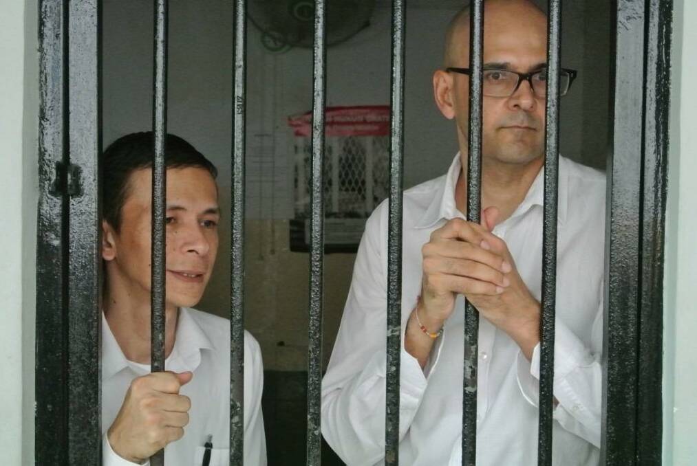 Ferdinant Tjiong (left) and Neil Bantleman, teachers at the newly named 'Jakarta Intercultural School' at the South Jakarta Court to face allegations of sexual assault against students. Photo: Michael Bachelard