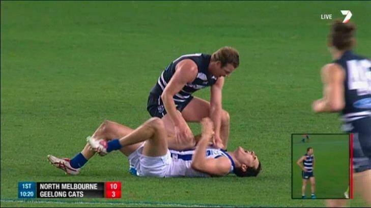 Geelong's Steve Johnson pushes his knee into the midriff of North Melbourne's Scott Thompson. Photo: Channel Seven