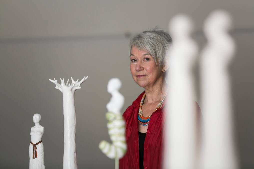 Artist Marija Patterson with some of the sculptures on display in her first solo exhibition at Beechworth. Picture: DYLAN ROBINSON