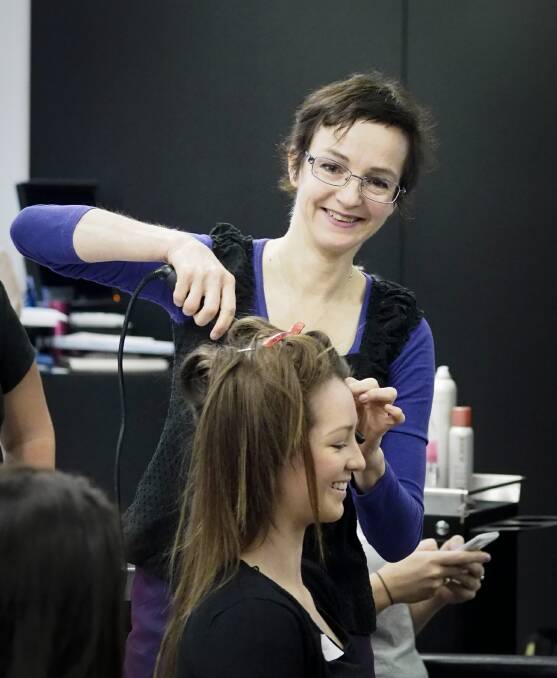 Guest demonstrator Melanie Ruth works on a model at the new hairdressing salon that has been launched at Wodonga TAFE.