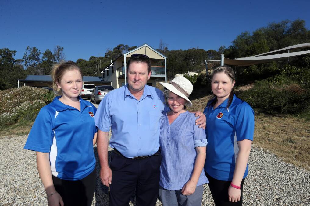 Eldorado’s Penney family Claire, 16, Michael, Jennifer and Emma, 22, enacted their bushfire plan in case the blaze came over the hill towards their property. Picture: PETER MERKESTEYN