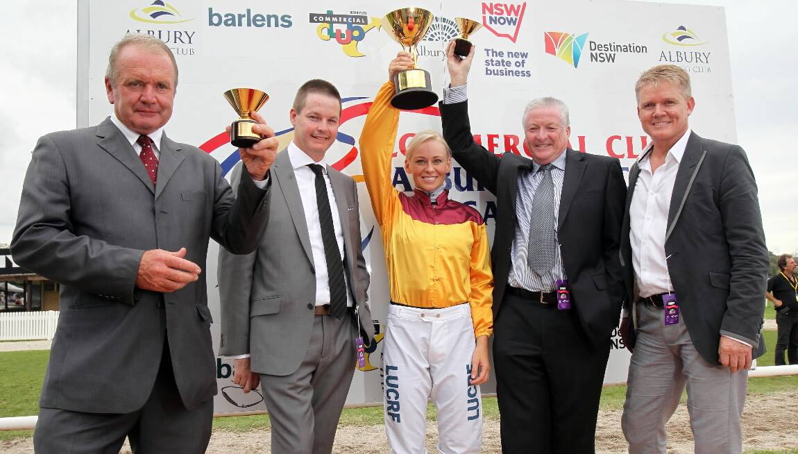 Trainer Guy Walter, left, with jockey Kathy O’Hara and owners of Canny Ballard Dan James, Rob James and John Price celebrate their win in yesterday’s gold cup. Picture: KYLIE ESLER