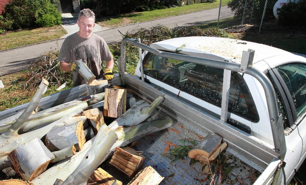 Sen-Constable Jason Frede with his load of firewood in the ute, showing the damaged roll bar. Picture: KYLIE ESLER
