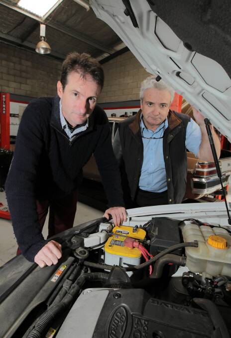 Tas Davies, who specialises in LPG conversions, and Albury Taxi owner Michel Bonner. Mr Davies says high LPG prices have put motorists off converting their cars. Picture: DAVID THORPE