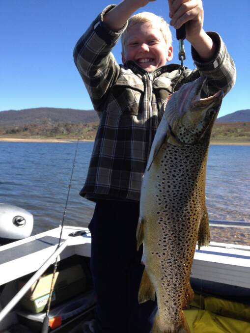 Ben White, 11, is proud as punch with his 2.4 kg brown trout caught at Jindabyne using a scubworm.