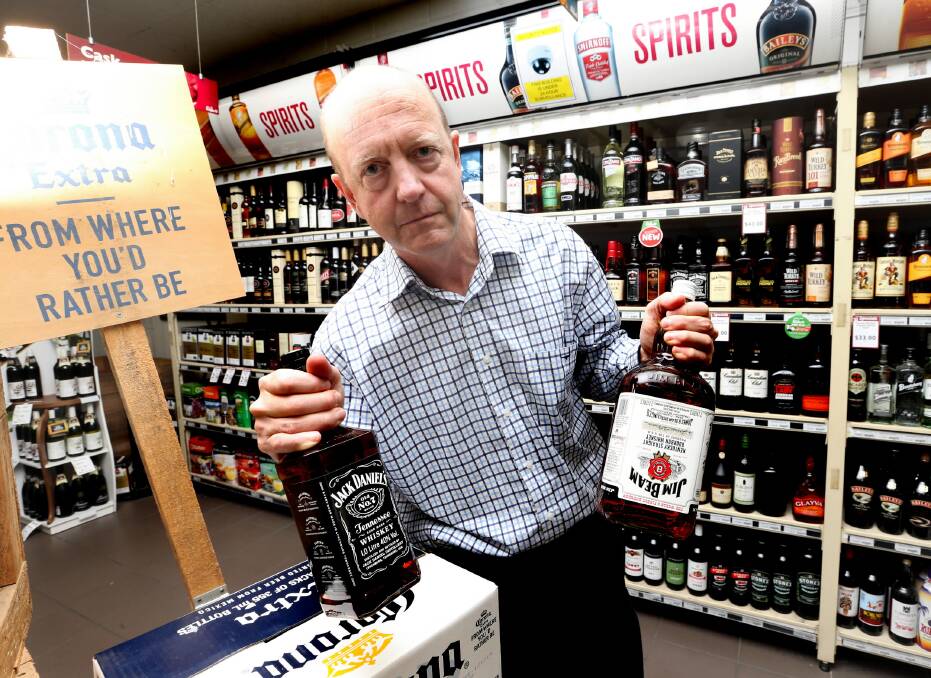 Elgin’s owner Tom Weatherall with bottles similar to the ones stolen from the pub at the weekend. Picture: PETER MERKESTEYN
