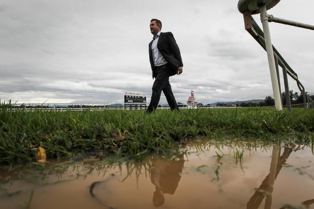 Racing Club president John Miller on a wet track at Albury yesterday that led to the club’s race meeting being abandoned. Picture: DYLAN ROBINSON