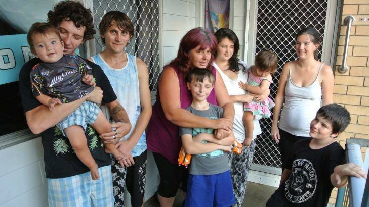 Lenore Lutanichi (centre) and her family at their Queensland housing commission house. Photo: Michael Bachelard