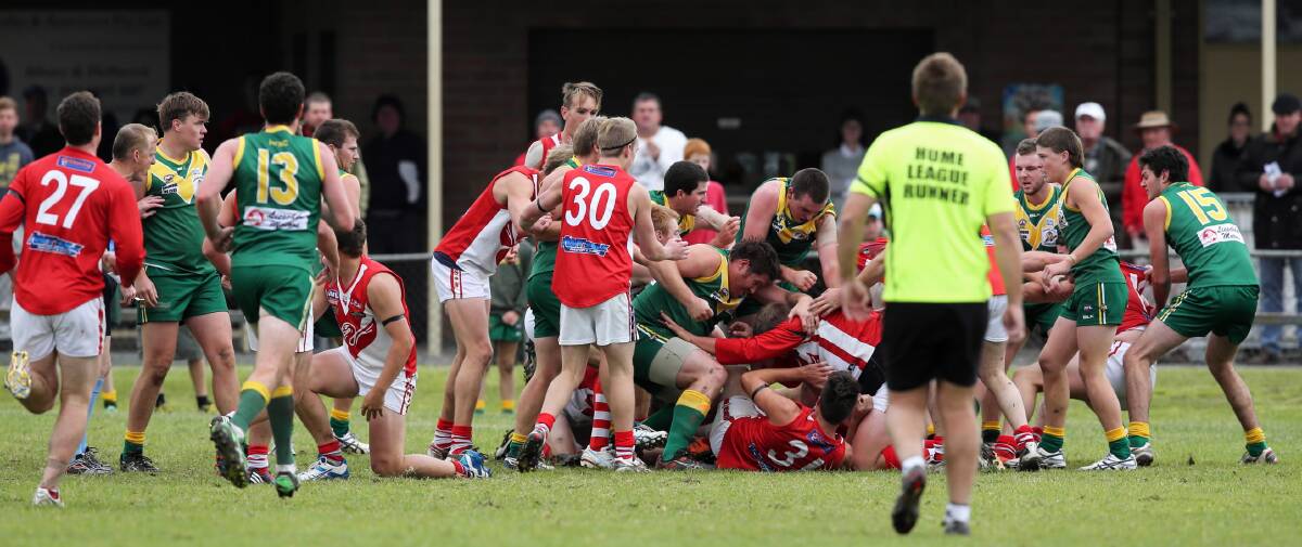 An all-in brawl erupted between players from Henty and Holbrook broke out on the siren at the end of the first quarter of Saturday’s game at Holbrook. Pictures: MATTHEW SMITHWICK